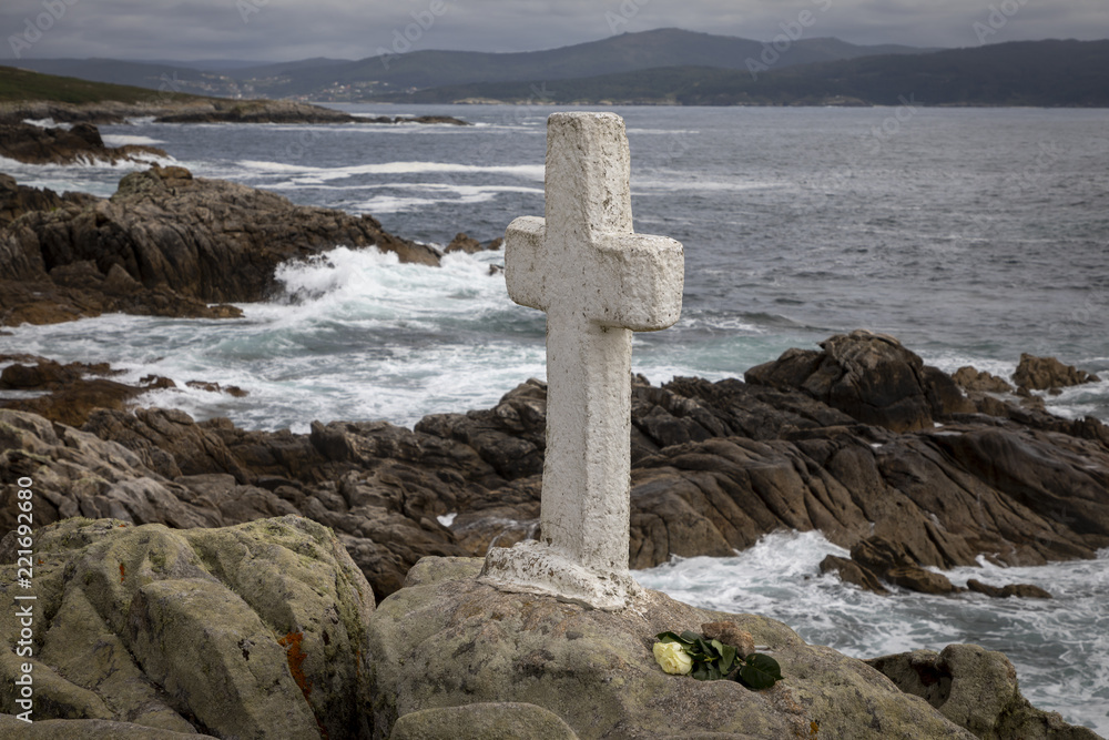 memorial cross for lost fishermen on Cape Roncudo (Faro de Cabo Roncudo) on the coast of death (costa da more ) in galicia, spain memorial cross for lost fishermen on Cape Roncudo (Faro de Cabo Roncudo) on the coast of death (costa da more ) in galicia, spain