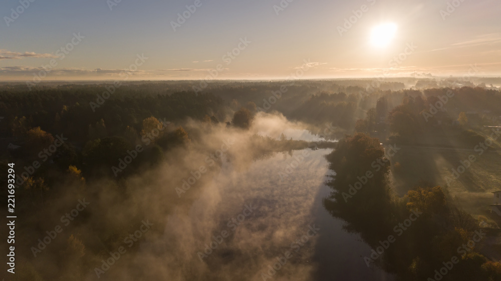 Fototapeta premium Morning smoke on the water Ulbroka lake Aerial drone top view Latvia