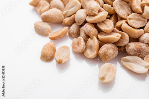 fresh peanuts on a white acrylic background