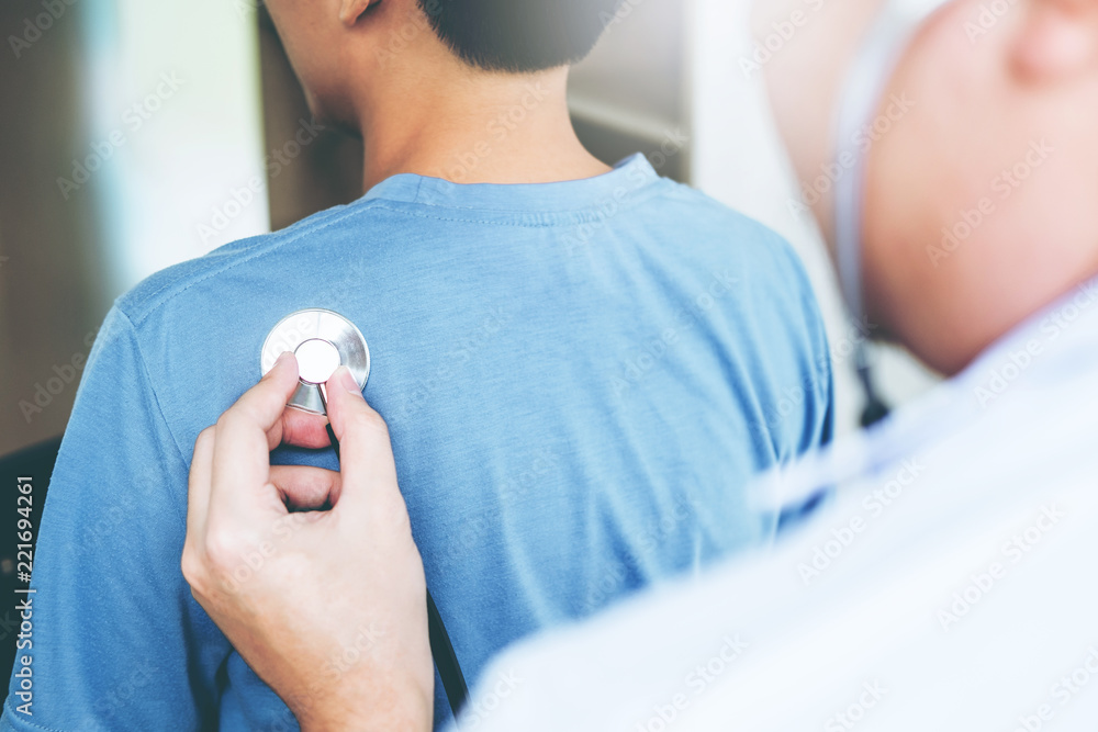 Fototapeta premium Doctor listening to patients breathing sound with Stethoscope