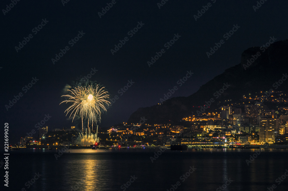 Panoramic lovely view of fireworks on the Principality of Monaco shortly after sunset