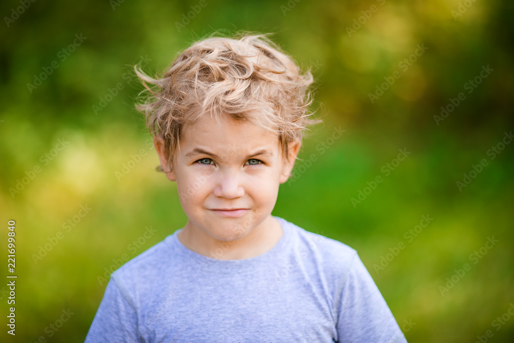 The portrait of blonde boy in green glasses The portrait of blonde boy in green glasses