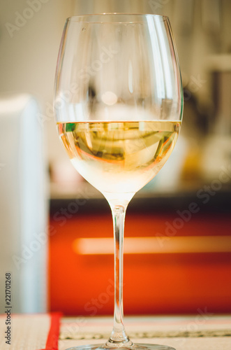 A glass with champagne, close-up, soft focus.