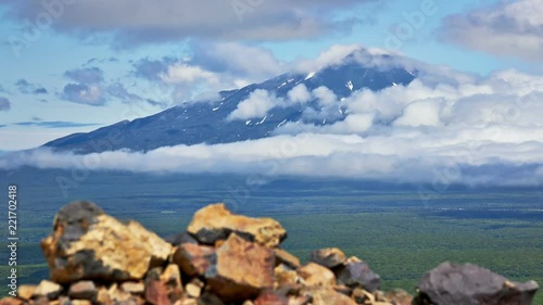 Kuril islads. Summer landscape with white cloud, fog and old vulkane. photo