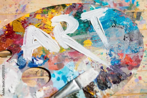 Panel kuchenny z motywem Word art painted with white gouache on colorful palette with paintbrush near by
