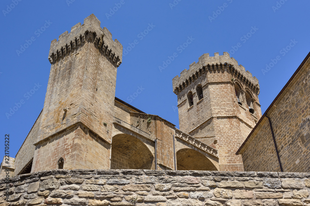 Spain, Navarre, Ujue: Detail view of famous church of Santa María de Ujue in the city center of old small Spanish village with blue sky in the background - concept travel religion national monument.