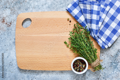 Mix of peppers and thyme on a concrete background. Food background with space for text. Advertising. photo