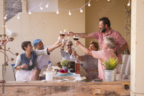 Photography happy group of different ages people celebrating and having fun together in friendship at home or restaurant