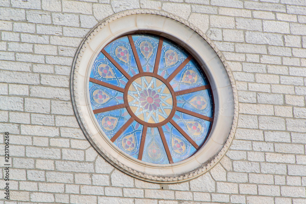 The colorful mosaic window on the Church