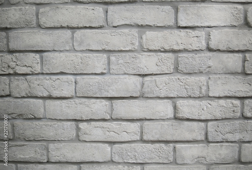 Modern white grey brick wall textured background.