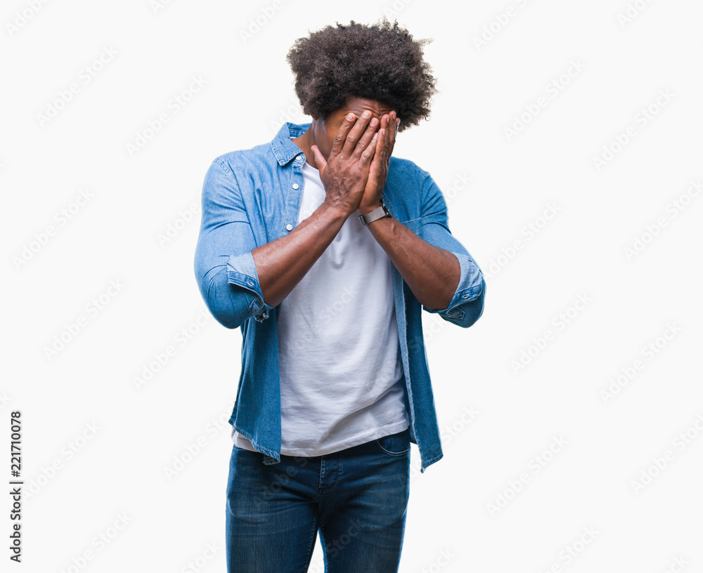 Afro american man over isolated background with sad expression covering face with hands while crying. Depression concept. Afro american man over isolated background with sad expression covering face with hands while crying. Depression concept.