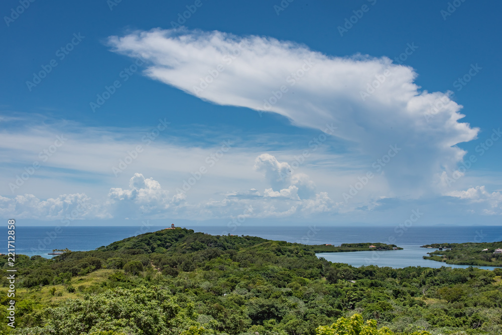 Cumulonimbus Anvil Cloud Over Caribbean Sea and Green Landscape Foreground Cumulonimbus Anvil Cloud Over Caribbean Sea and Green Landscape Foreground