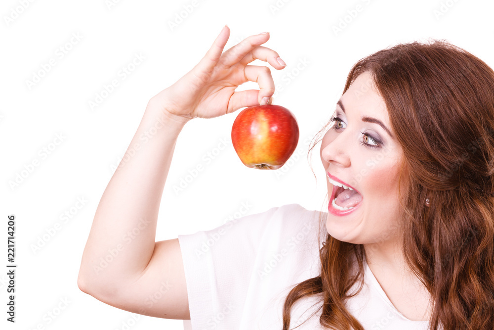 Woman holds apple fruit close to face, isolated Woman holds apple fruit close to face, isolated