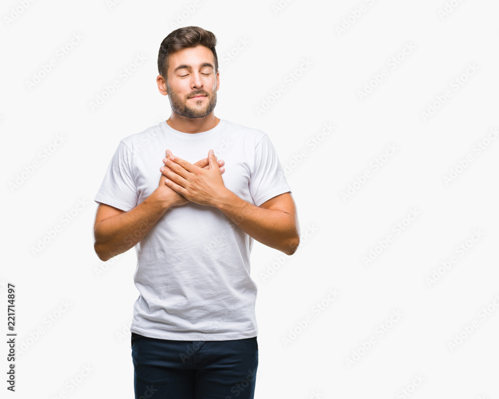 Young handsome man over isolated background smiling with hands on chest with closed eyes and grateful gesture on face. Health concept. Young handsome man over isolated background smiling with hands on chest with closed eyes and grateful gesture on face. Health concept.