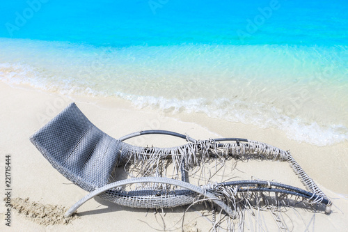 Worn deck chair by the sea photo