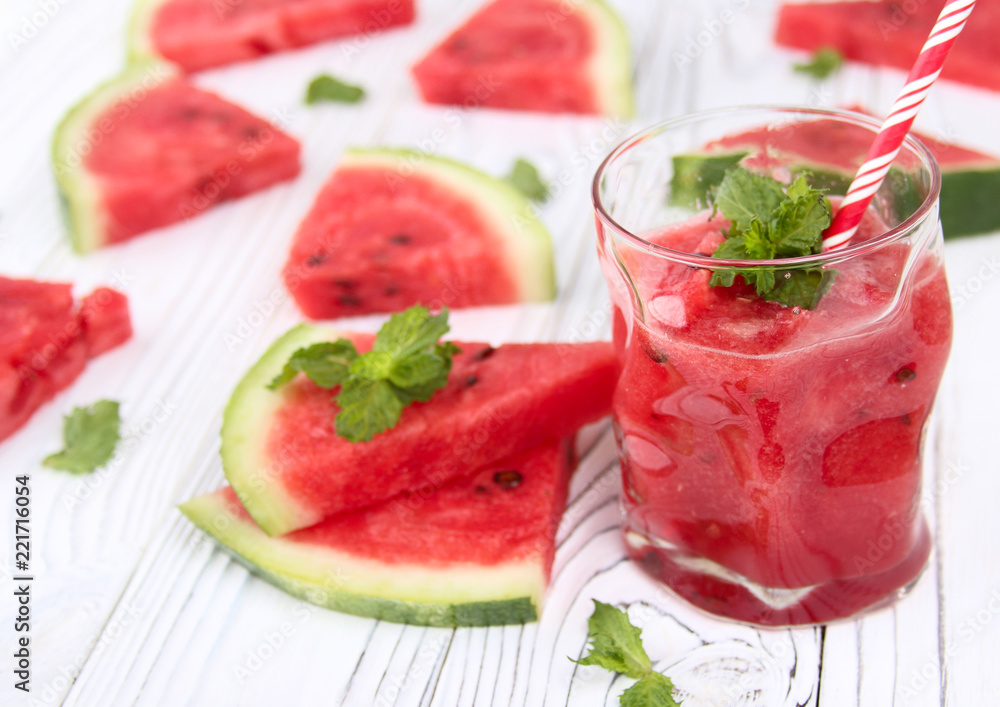 Watermelon lemonade on a wooden table with colorful drinking straws. Watermelon lemonade on a wooden table with colorful drinking straws.