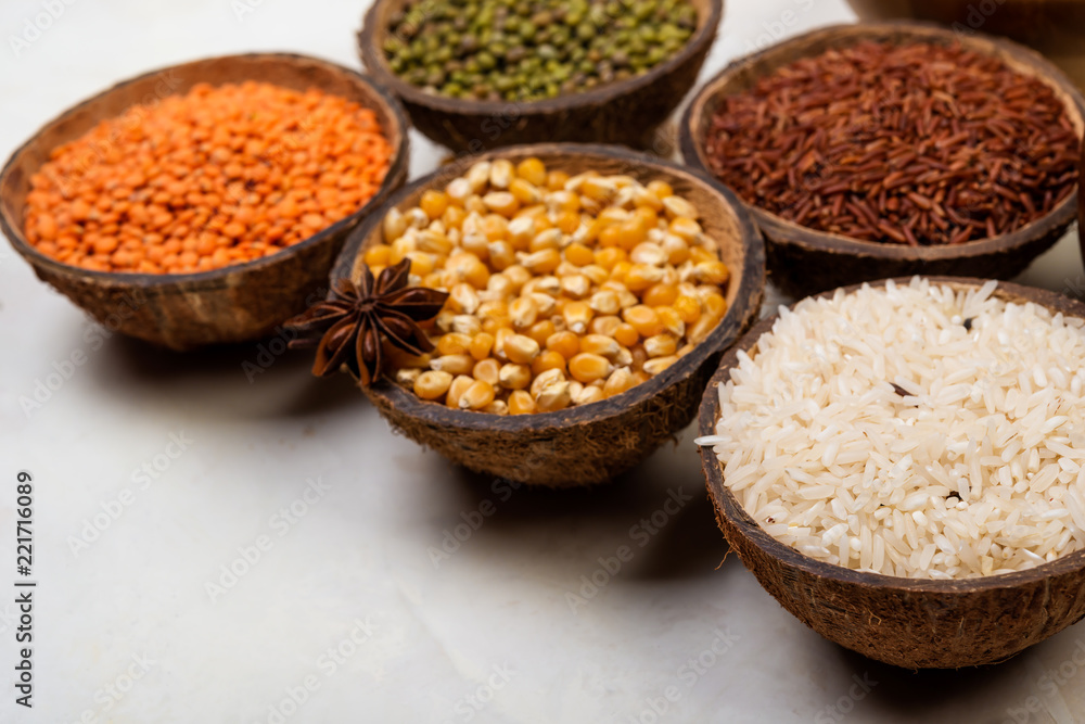 cereals, seeds, beans, grains in a bowls on white table cereals, seeds, beans, grains in a bowls on white table