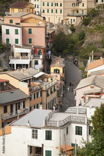 the main street in the townof Manarola, Italy as it winds its way throughthe town and up to its main square on top photo