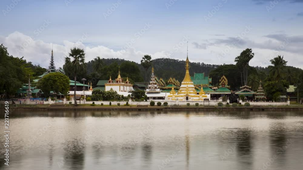 Time lapse of golden pagoda reflection on water located at Mae Hong Son north of Thailand Time lapse of golden pagoda reflection on water located at Mae Hong Son north of Thailand