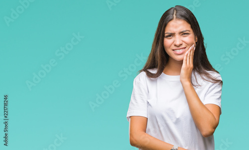 Konstfotografi Young beautiful arab woman over isolated background touching mouth with hand with painful expression because of toothache or dental illness on teeth