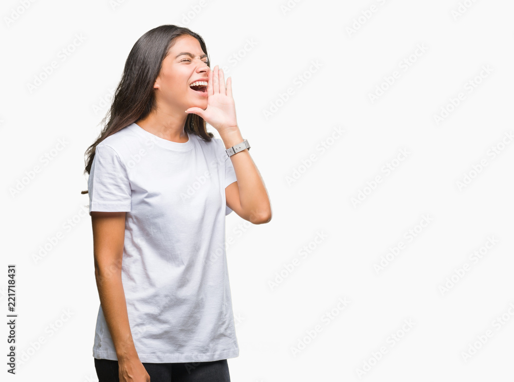 Young beautiful arab woman over isolated background shouting and screaming loud to side with hand on mouth. Communication concept. Young beautiful arab woman over isolated background shouting and screaming loud to side with hand on mouth. Communication concept.