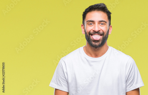 Adult hispanic man over isolated background sticking tongue out happy with funny expression. Emotion concept. © Krakenimages.com