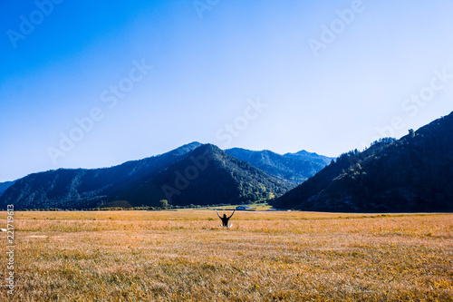 girl at the foot of big mountains in the Altai Republics