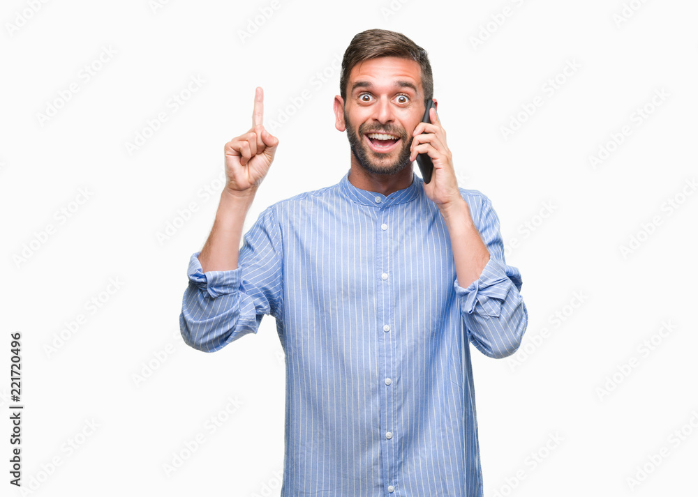 Young handsome man speaking on the phone over isolated background surprised with an idea or question pointing finger with happy face, number one Young handsome man speaking on the phone over isolated background surprised with an idea or question pointing finger with happy face, number one