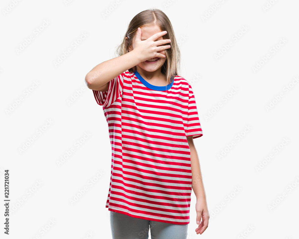 Young beautiful girl over isolated background smiling and laughing with hand on face covering eyes for surprise. Blind concept. Young beautiful girl over isolated background smiling and laughing with hand on face covering eyes for surprise. Blind concept.