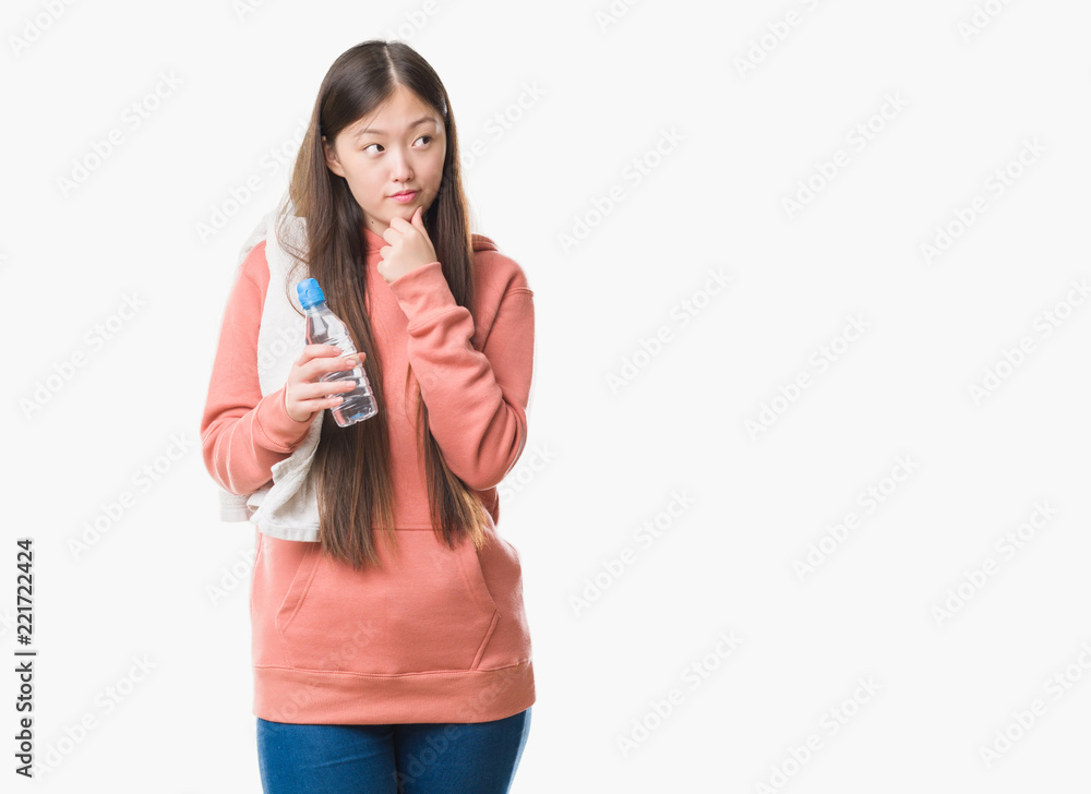 Young Chinese woman over isolated background wearing sport sweathshirt serious face thinking about question, very confused idea Young Chinese woman over isolated background wearing sport sweathshirt serious face thinking about question, very confused idea