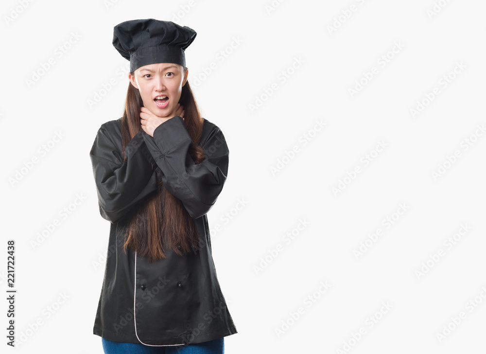 Young Chinese woman over isolated background wearing chef uniform shouting and suffocate because painful strangle. Health problem. Asphyxiate and suicide concept. Young Chinese woman over isolated background wearing chef uniform shouting and suffocate because painful strangle. Health problem. Asphyxiate and suicide concept.