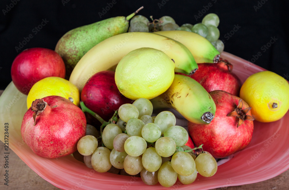 pomegranates and other fruits in a bowl pomegranates and other fruits in a bowl