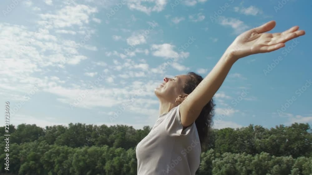 Freedom. The woman on the nature stretched out her arms. Freedom. The woman on the nature stretched out her arms.