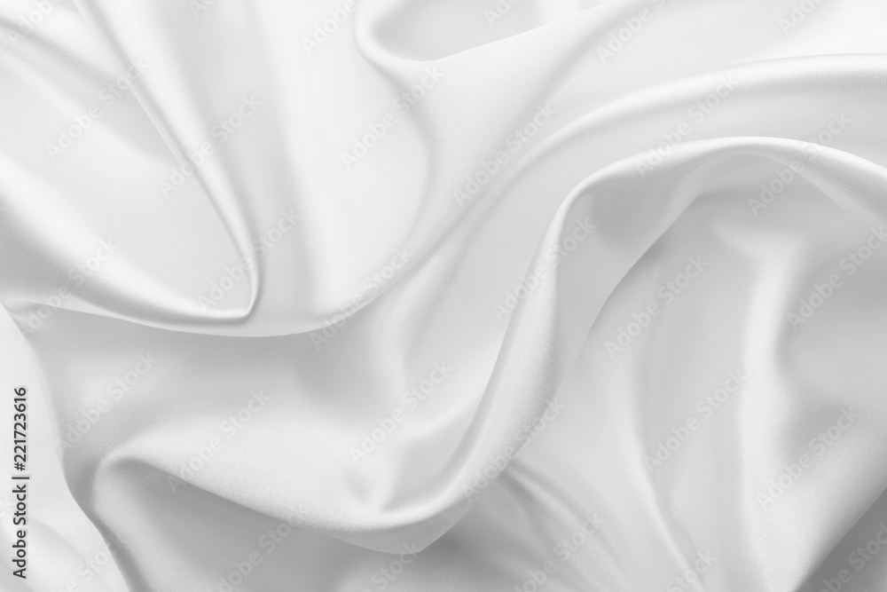Fototapeta premium Elegant white satin silk with waves, abstract background.