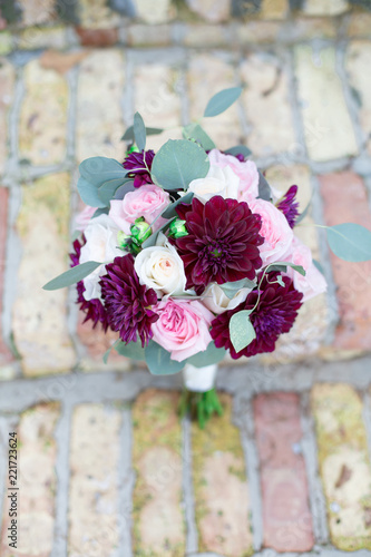 Red and Pink Rose Bouquet on Brick Stairs