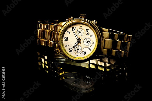 gold watch with reflection