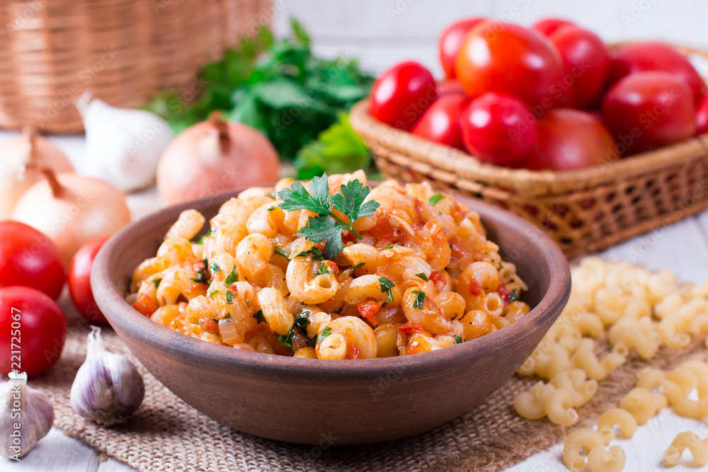 Pasta with tomato sauce on a plate on table Pasta with tomato sauce on a plate on table