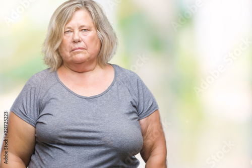 Senior plus size caucasian woman over isolated background depressed and worry for distress, crying angry and afraid. Sad expression.