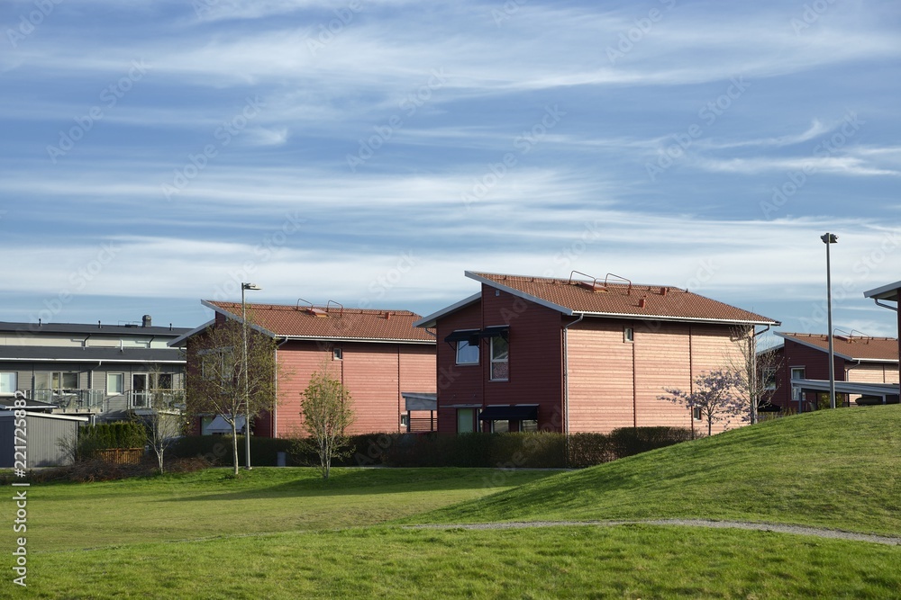 Environmental documentary of coastal lifestyle. Here a Swedish home in summer with blue sky.