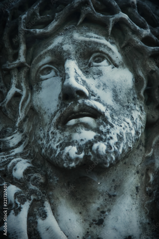 Close up of antique statue Jesus Christ as a symbol of love, faith and religion.