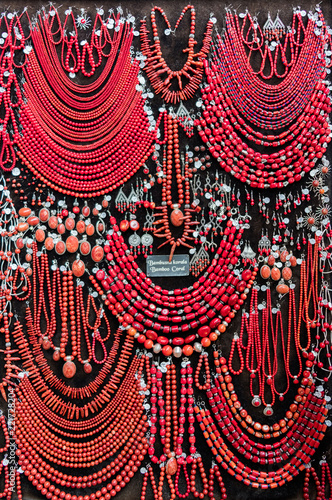 Assorted red Bamboo Coral jewelry on display at a local jewelry store.