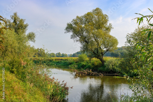 River landscape on a background of blue sky at sunny autumn morning