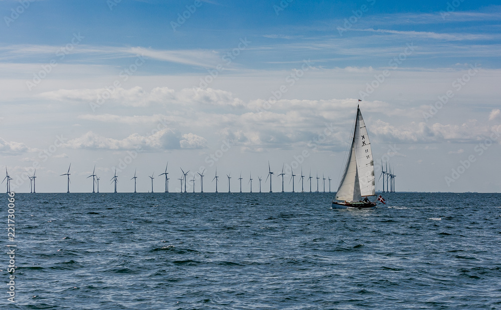 Obraz premium Sailing boat on the background of wind craft park