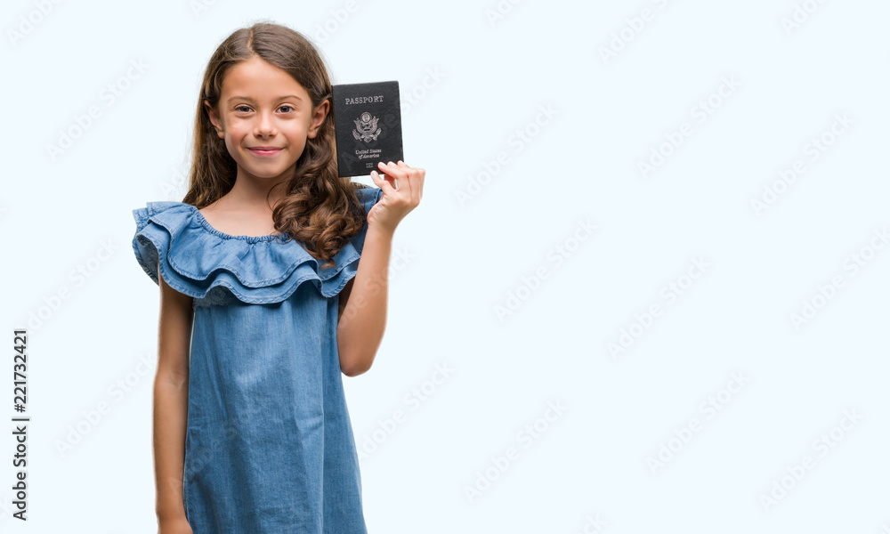 Brunette hispanic girl holding passport of United States of America with a happy face standing and smiling with a confident smile showing teeth