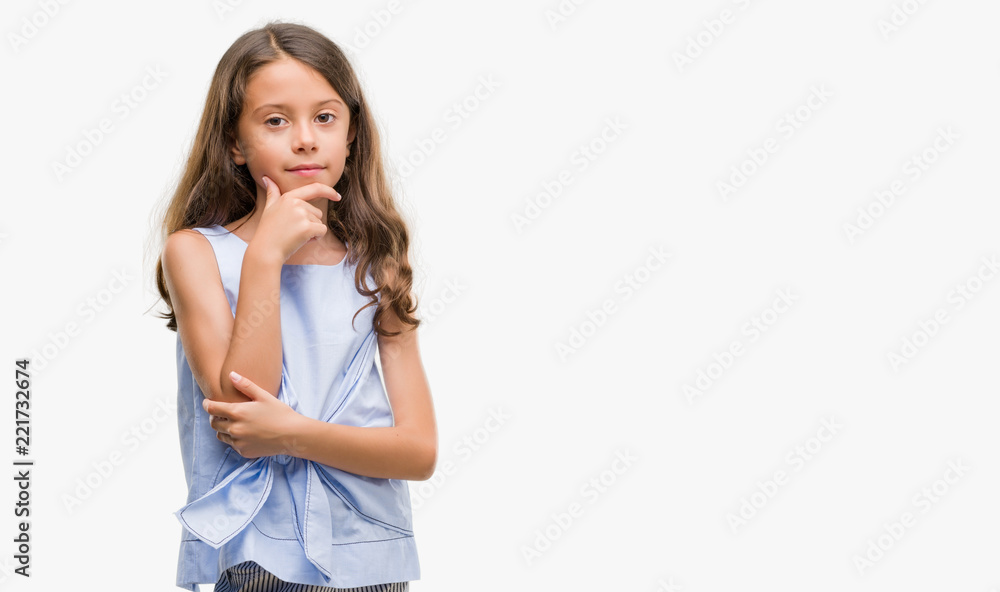Brunette hispanic girl looking confident at the camera with smile with crossed arms and hand raised on chin. Thinking positive. Brunette hispanic girl looking confident at the camera with smile with crossed arms and hand raised on chin. Thinking positive.