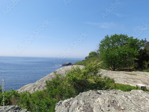 Scenic view of sky, rocks, and water on a spring day.