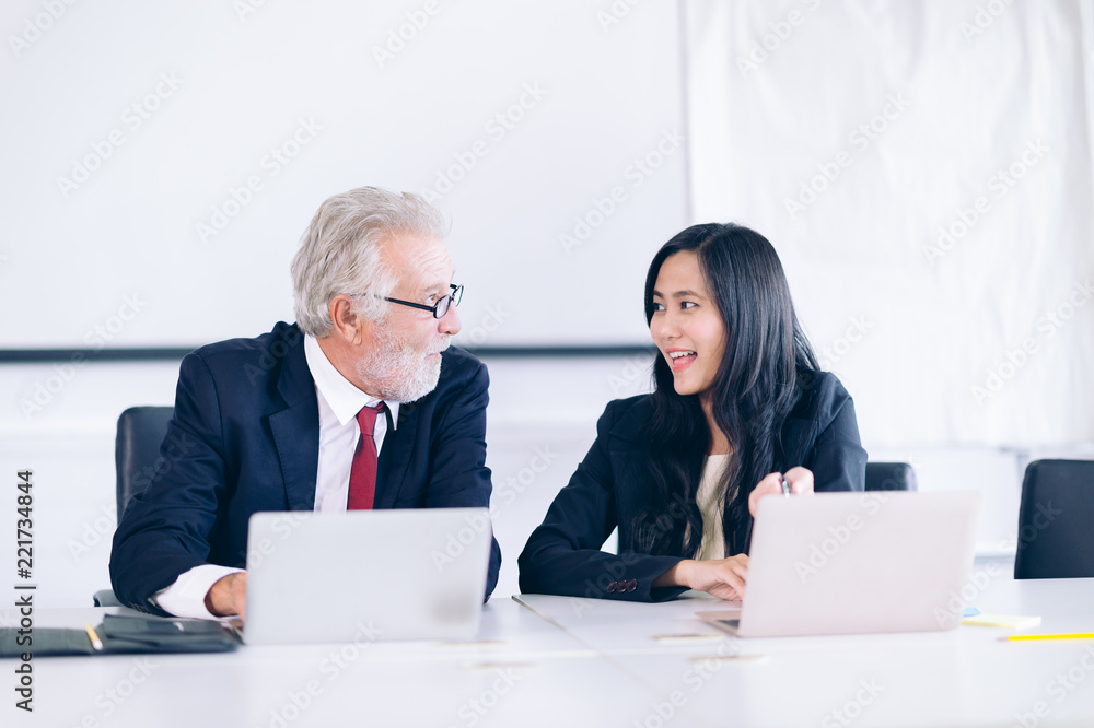 Confident businessman boss working with employee at work place,Business people discussion and analyzing plan a new project Confident businessman boss working with employee at work place,Business people discussion and analyzing plan a new project