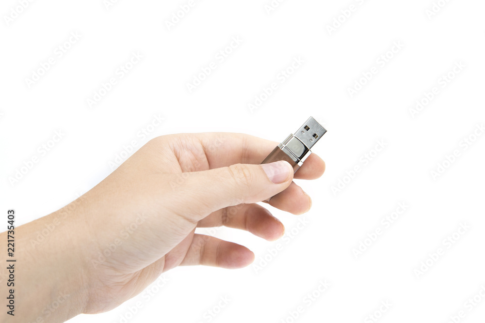 flash drive in woman's hand on white background. Female's hand holding flash drive. flash drive in woman's hand on white background. Female's hand holding flash drive.