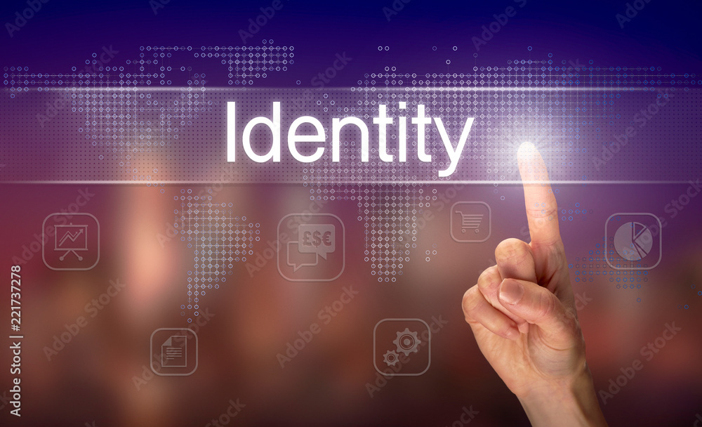 A hand selecting a Identity business concept on a clear screen with a colorful blurred background.