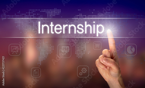 A hand selecting a Internship business concept on a clear screen with a colorful blurred background.